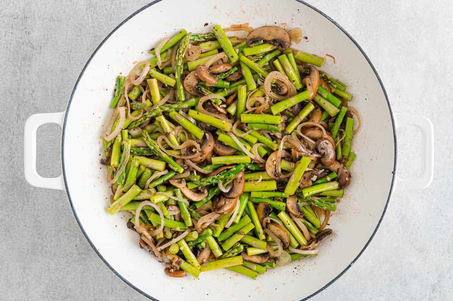 Asparagus added to pan.