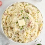 Mashed red potatoes with butter and chives.