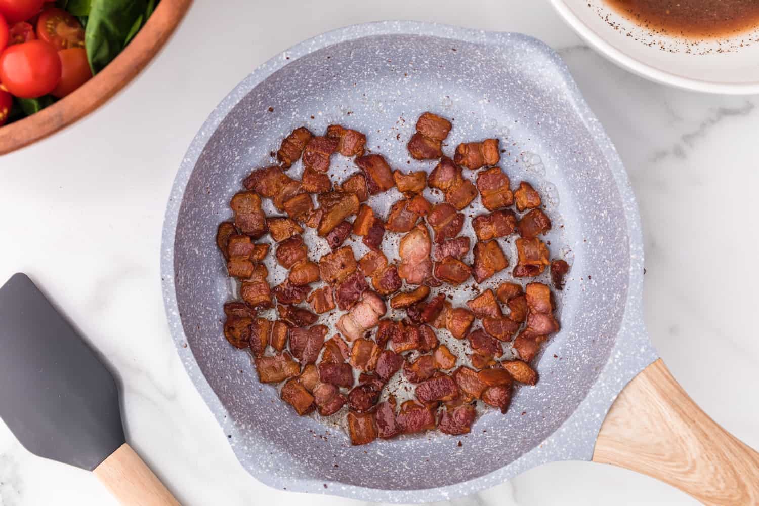 Cooked bacon in a skillet.