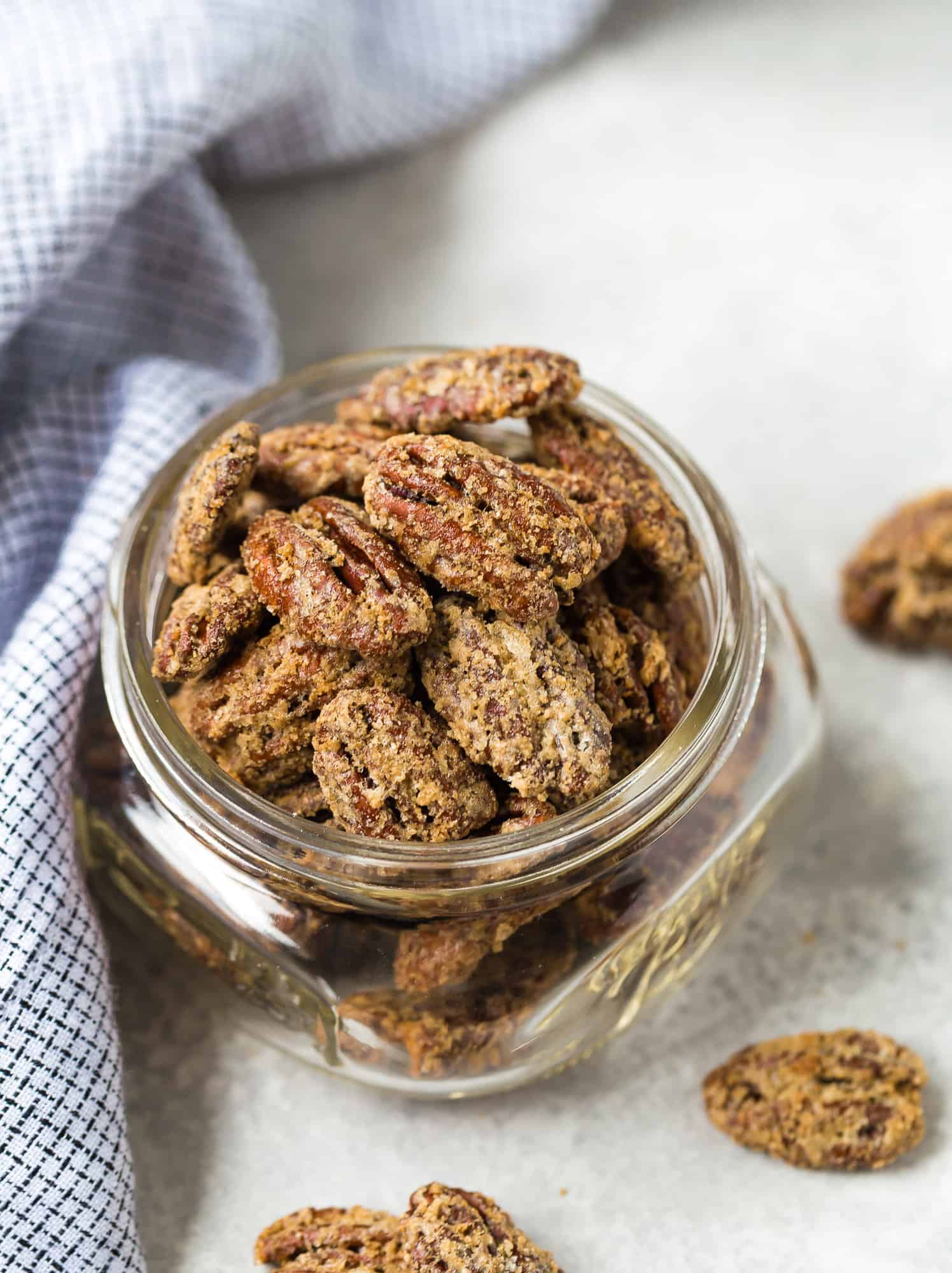 Candied bourbon pecans in a jar.