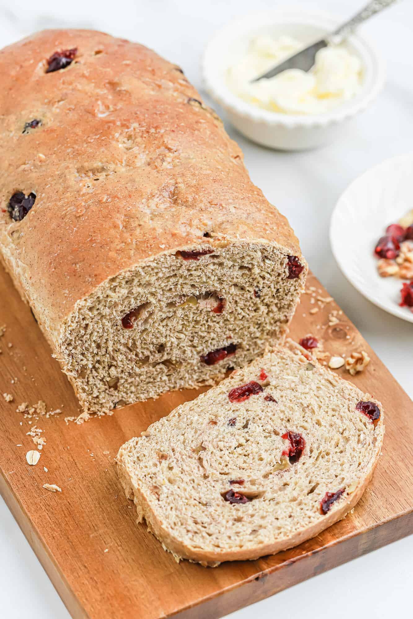 Cranberry walnut bread, partially sliced.