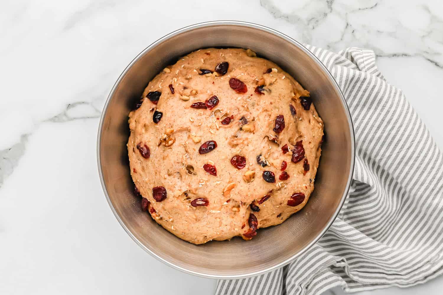 Dough with cranberries and walnuts mixed in.