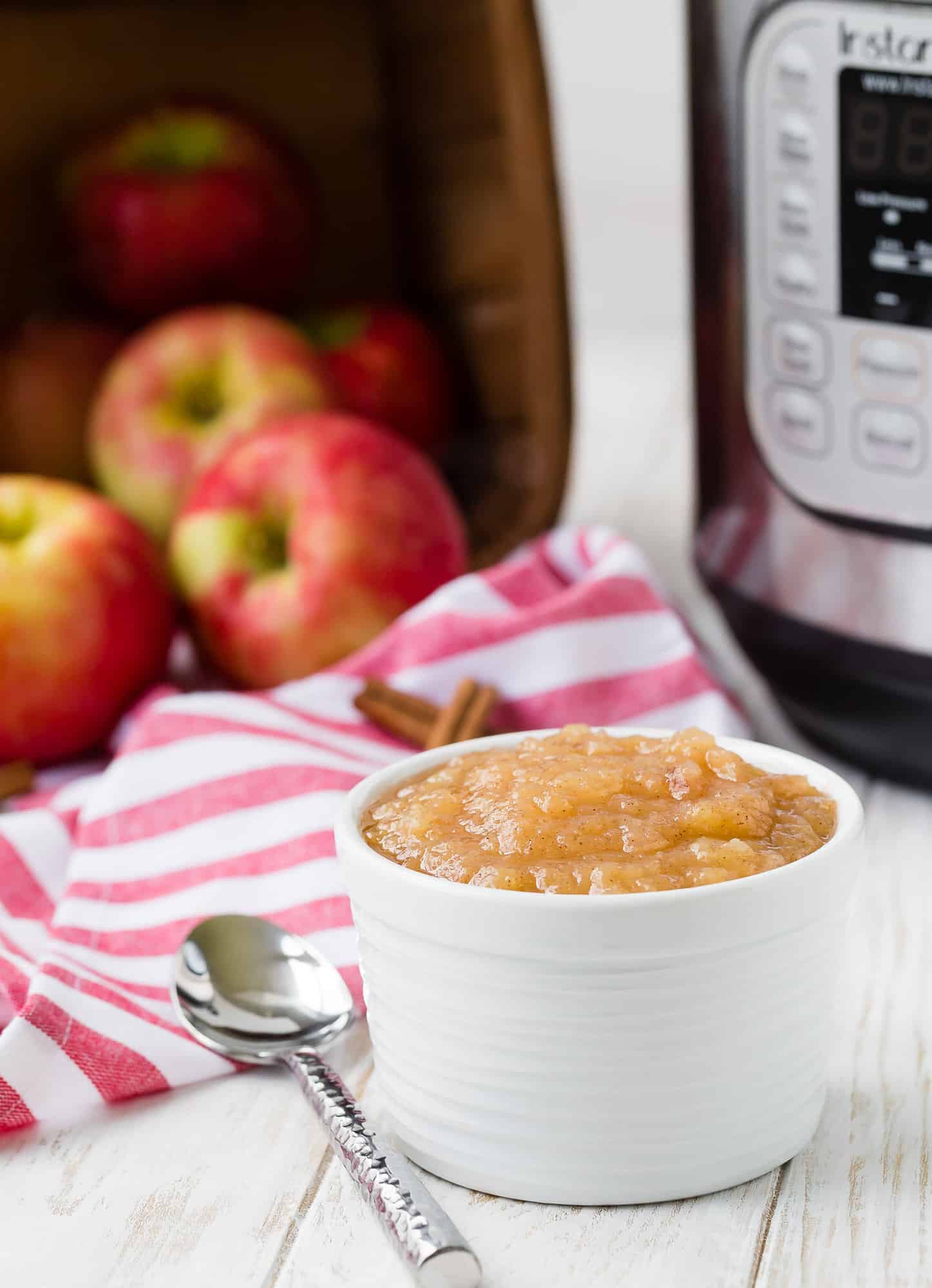 Applesauce in front of an Instant Pot.