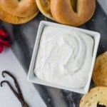 Vanilla bean whipped cream cheese in a square bowl.