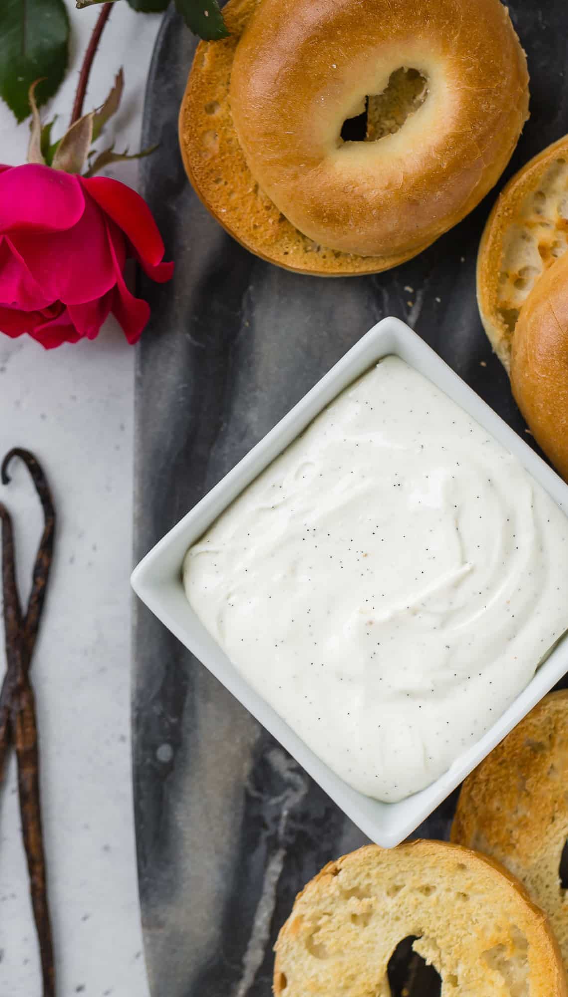 Vanilla bean whipped cream cheese in a square bowl.