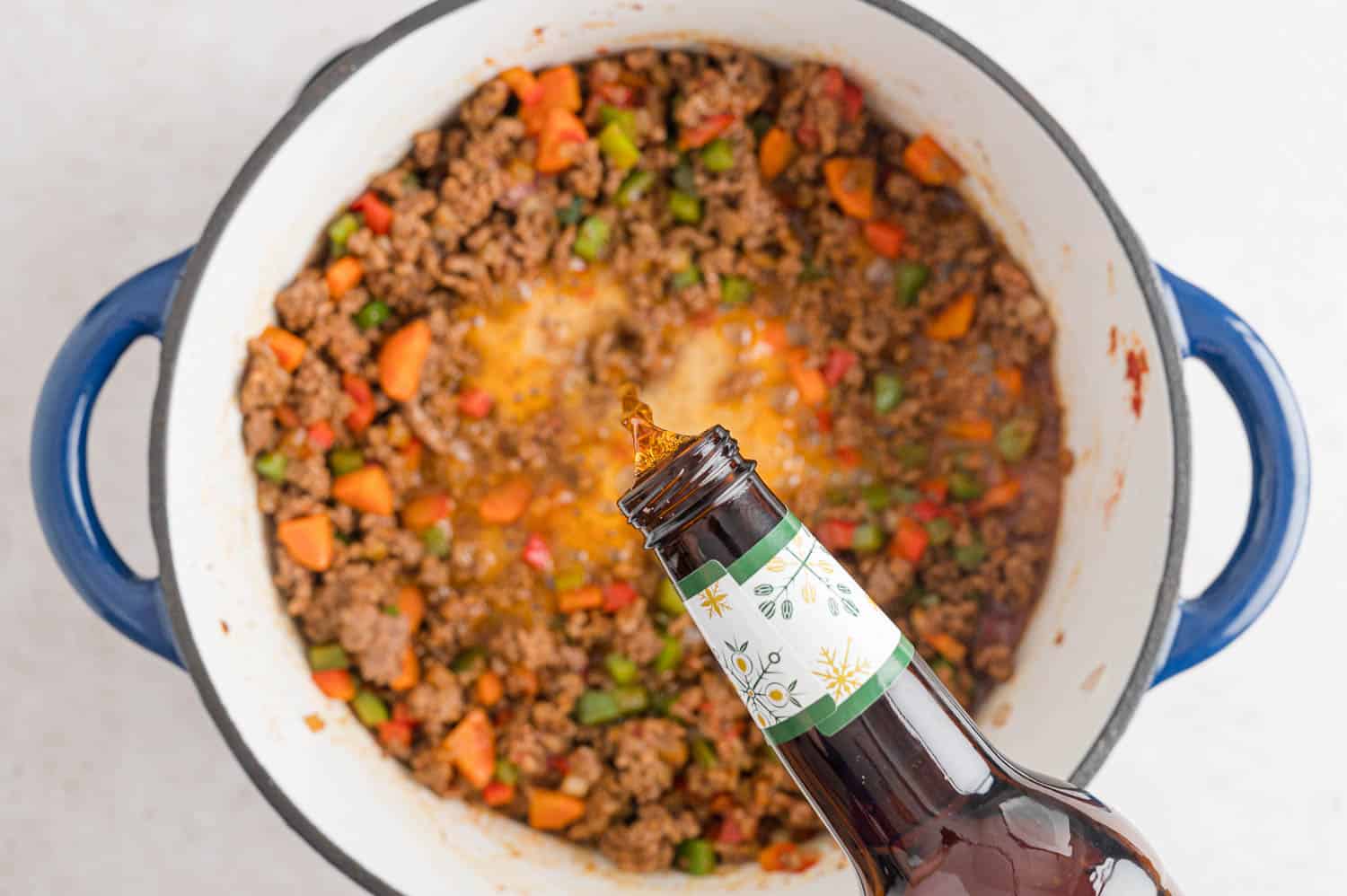 Beer being added to pan.