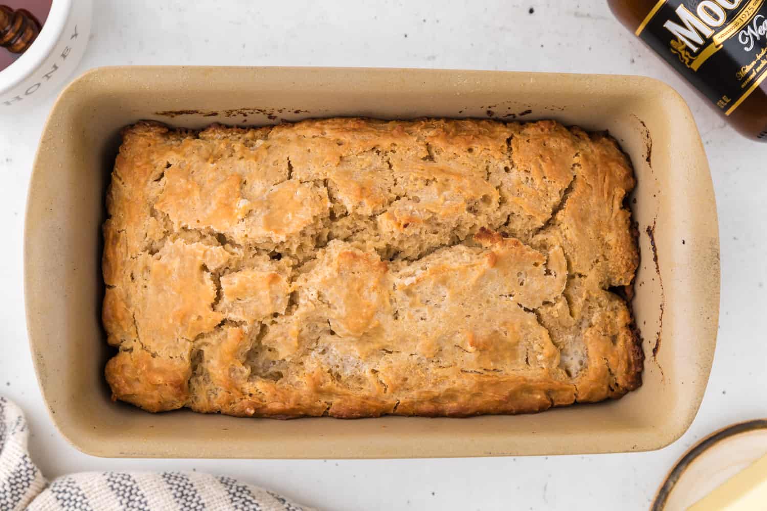 Baked bread in a loaf pan.