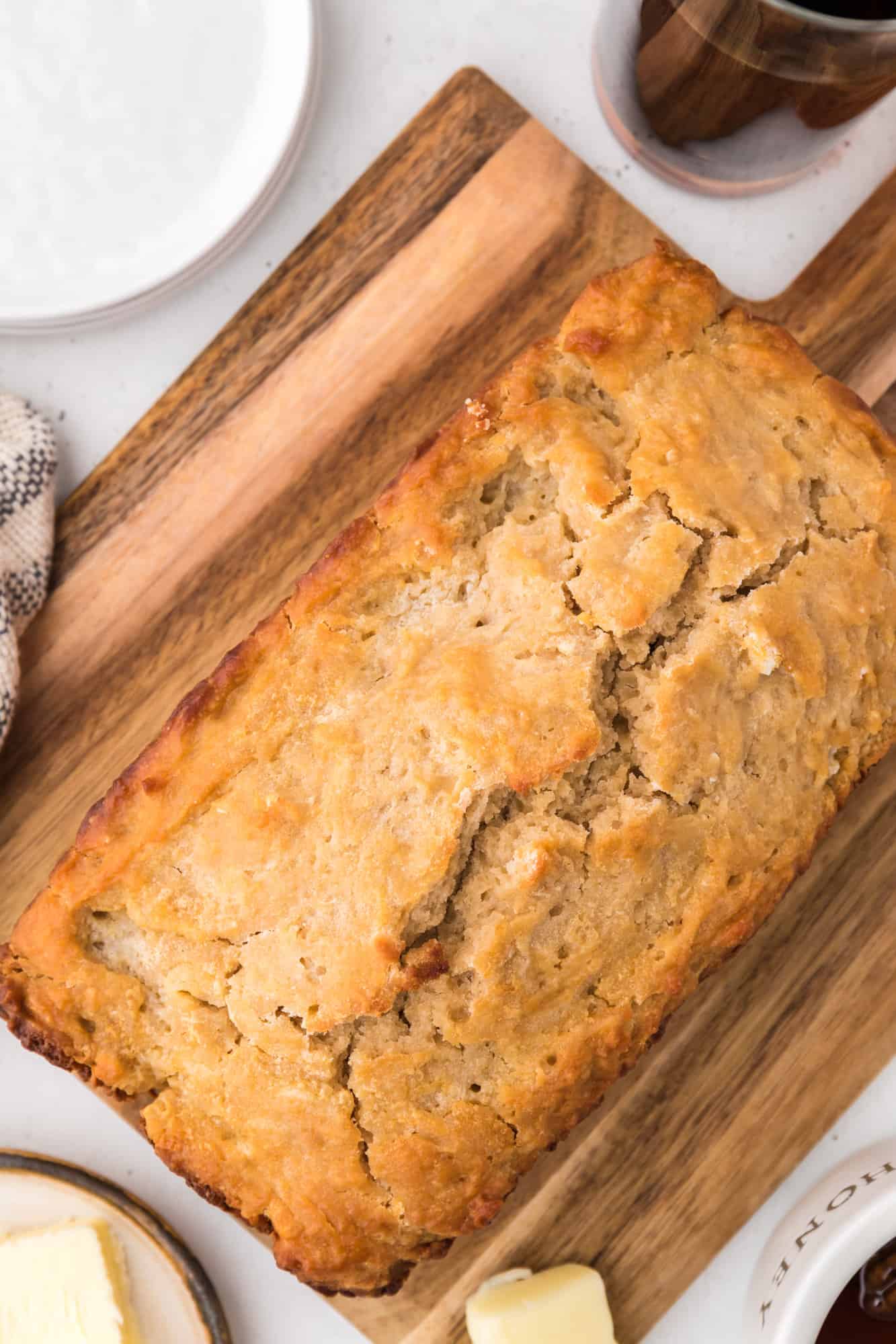 Bread on cutting board, unsliced.