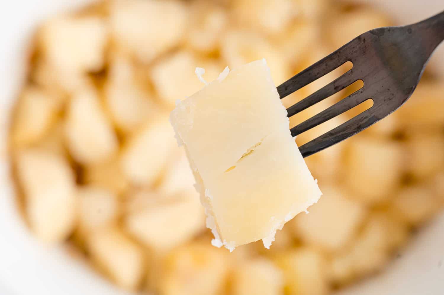 Fork in a cooked potato.