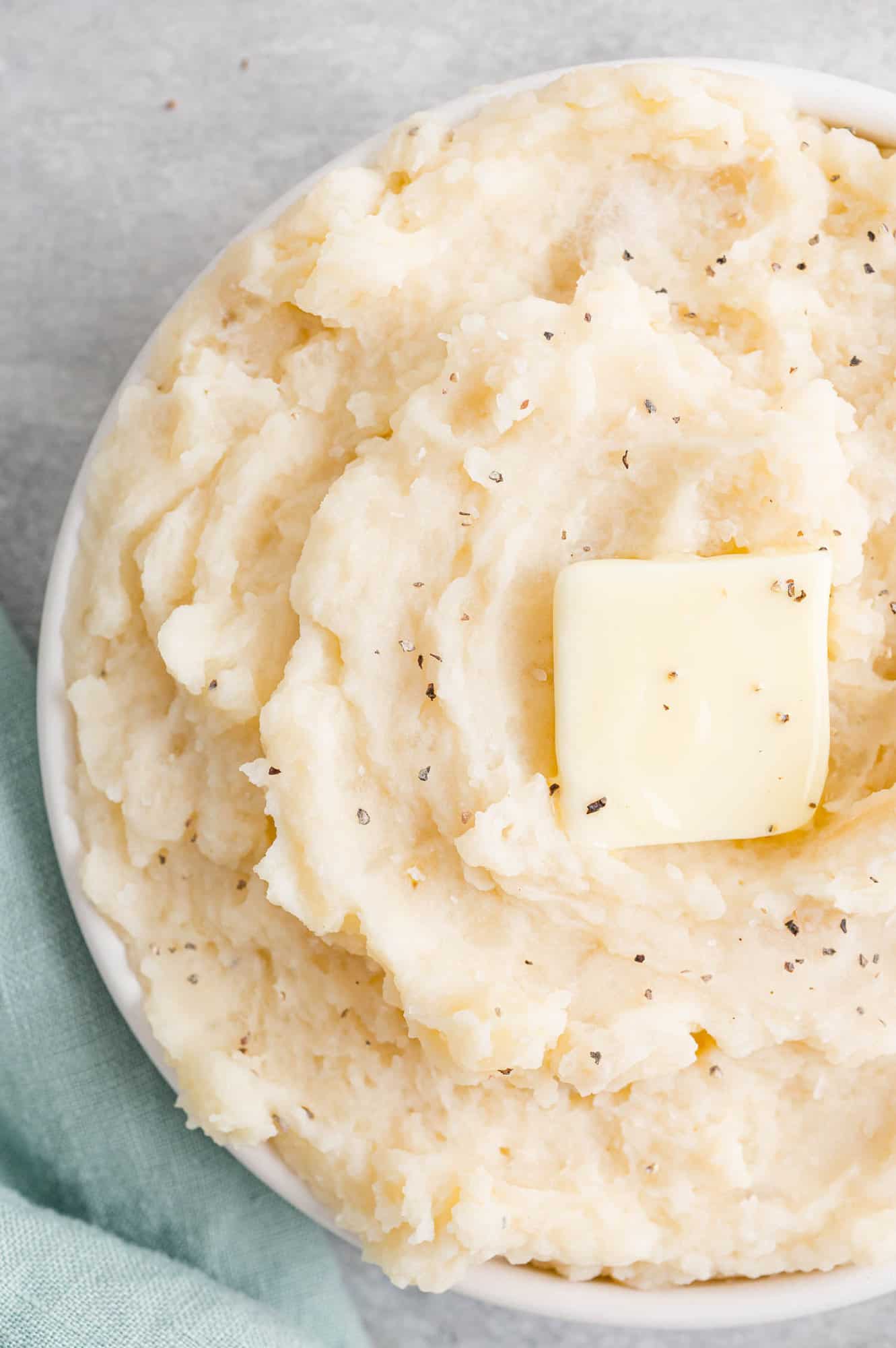 Crockpot mashed potatoes topped with butter.