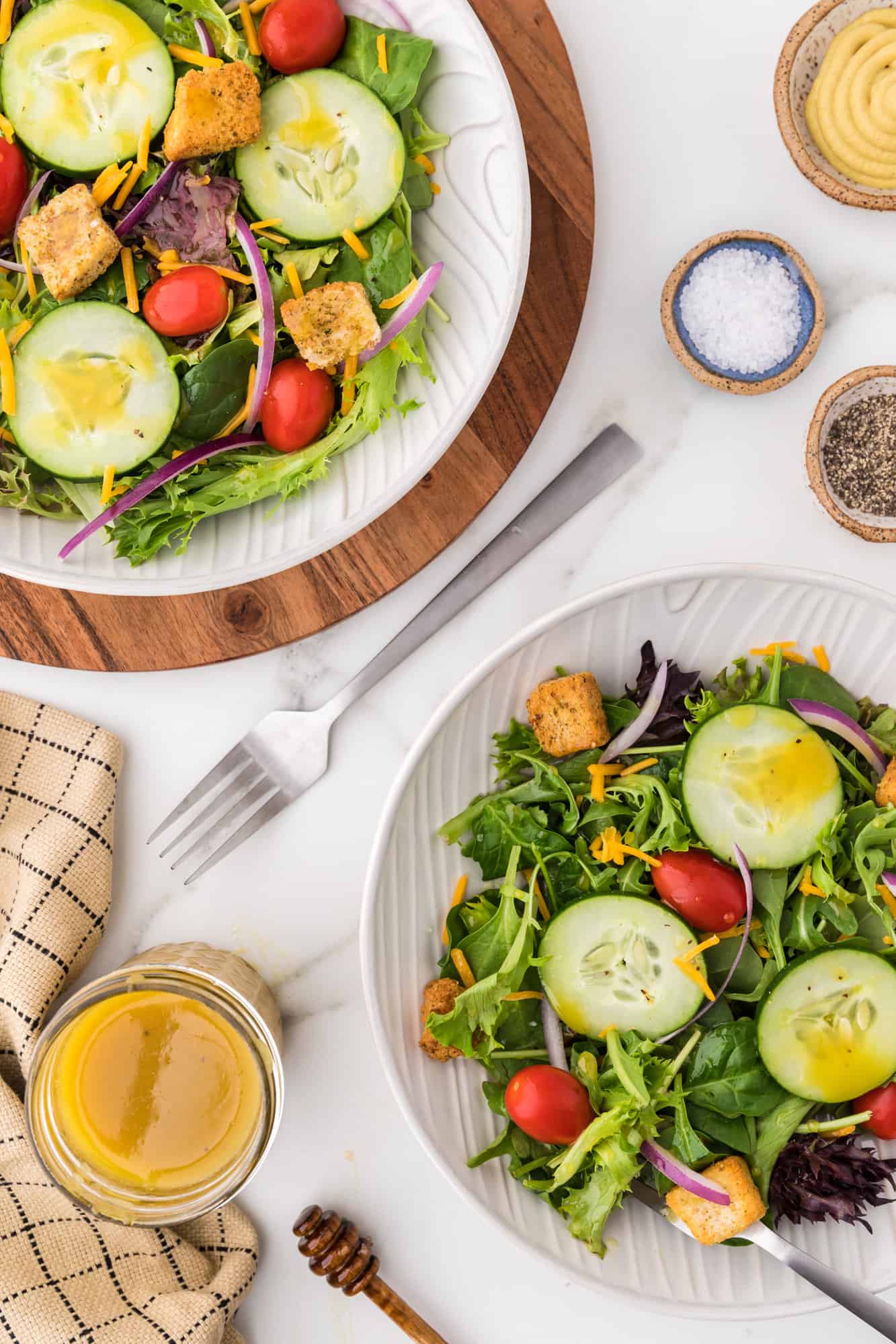 Two tossed salads with honey mustard vinaigrette.