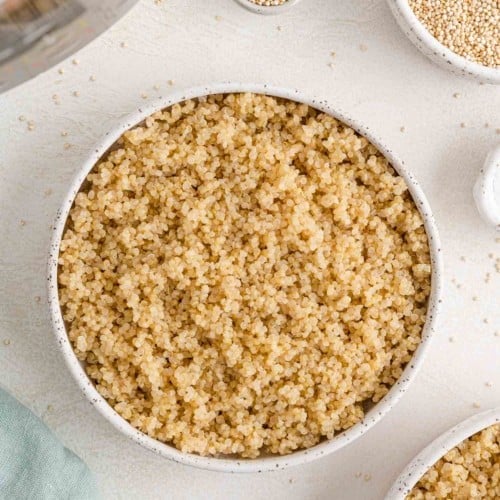 Fluffy cooked quinoa in a bowl.