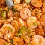 Close up of jambalaya with serving spoon.
