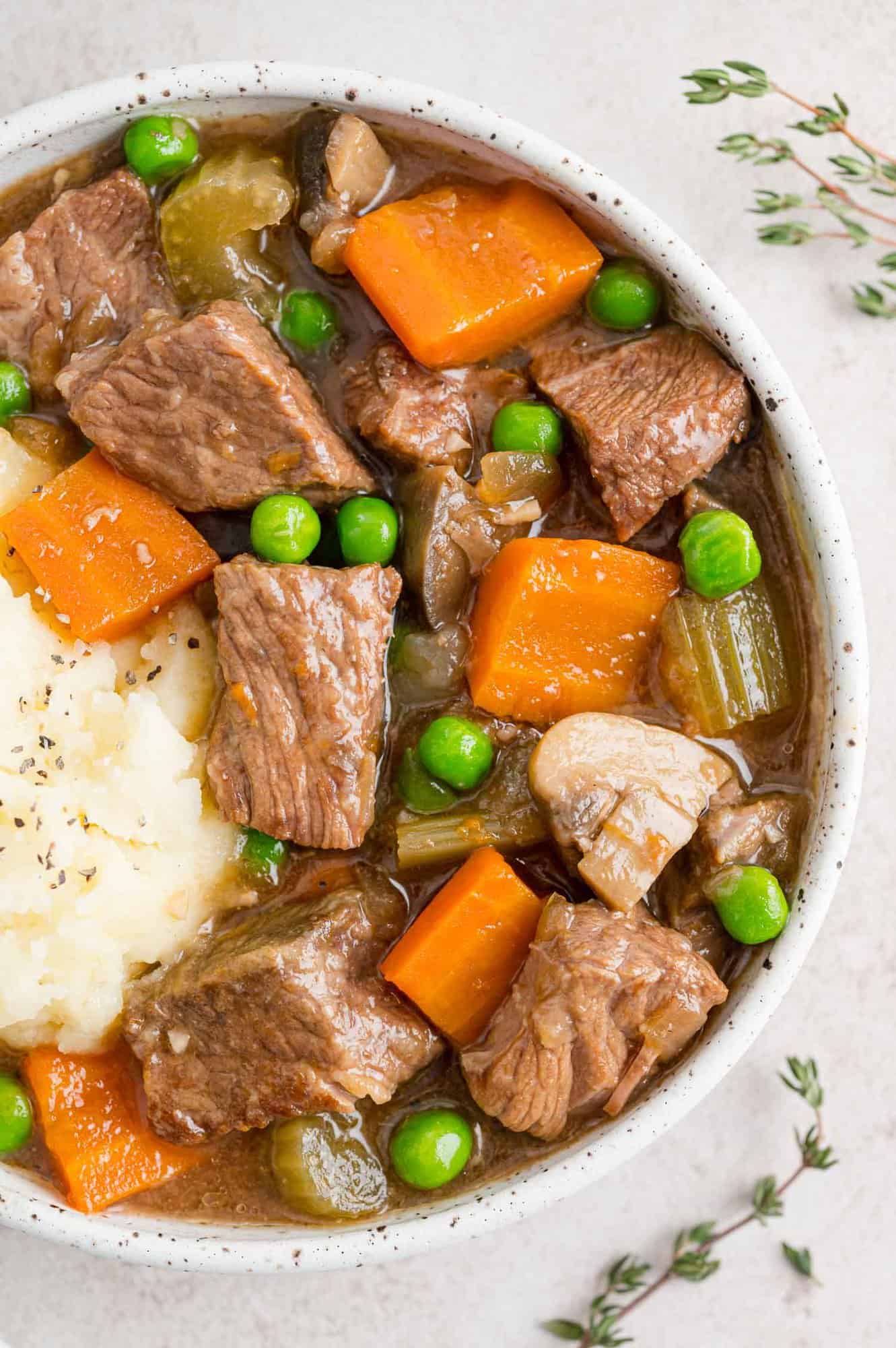 Slow Cooker beef marsala in a bowl with potatoes.