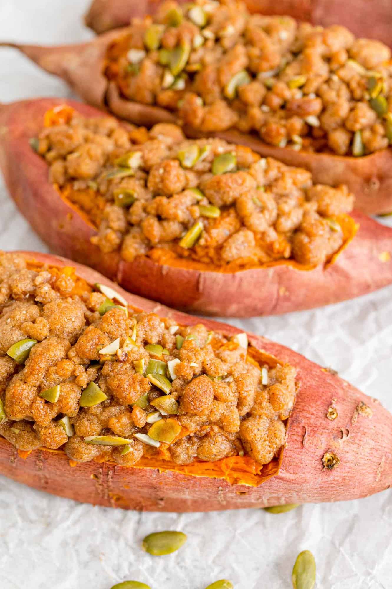 twice-baked-sweet-potatoes-2 Three twice baked sweet potatoes with a streusel topping.
