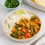 Butternut squash curry in a bowl with rice.