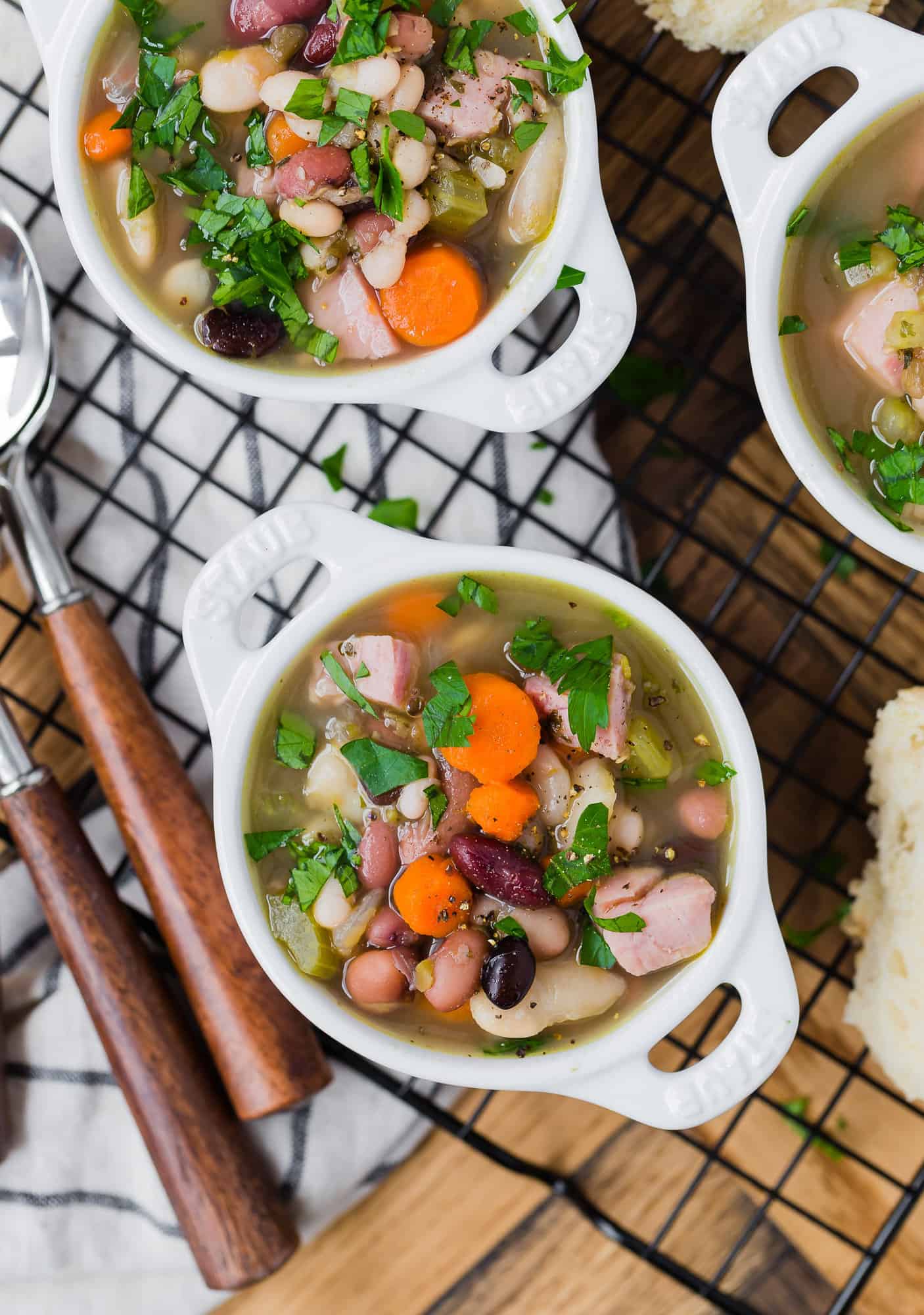Bean and ham soup with vegetables and parsley.
