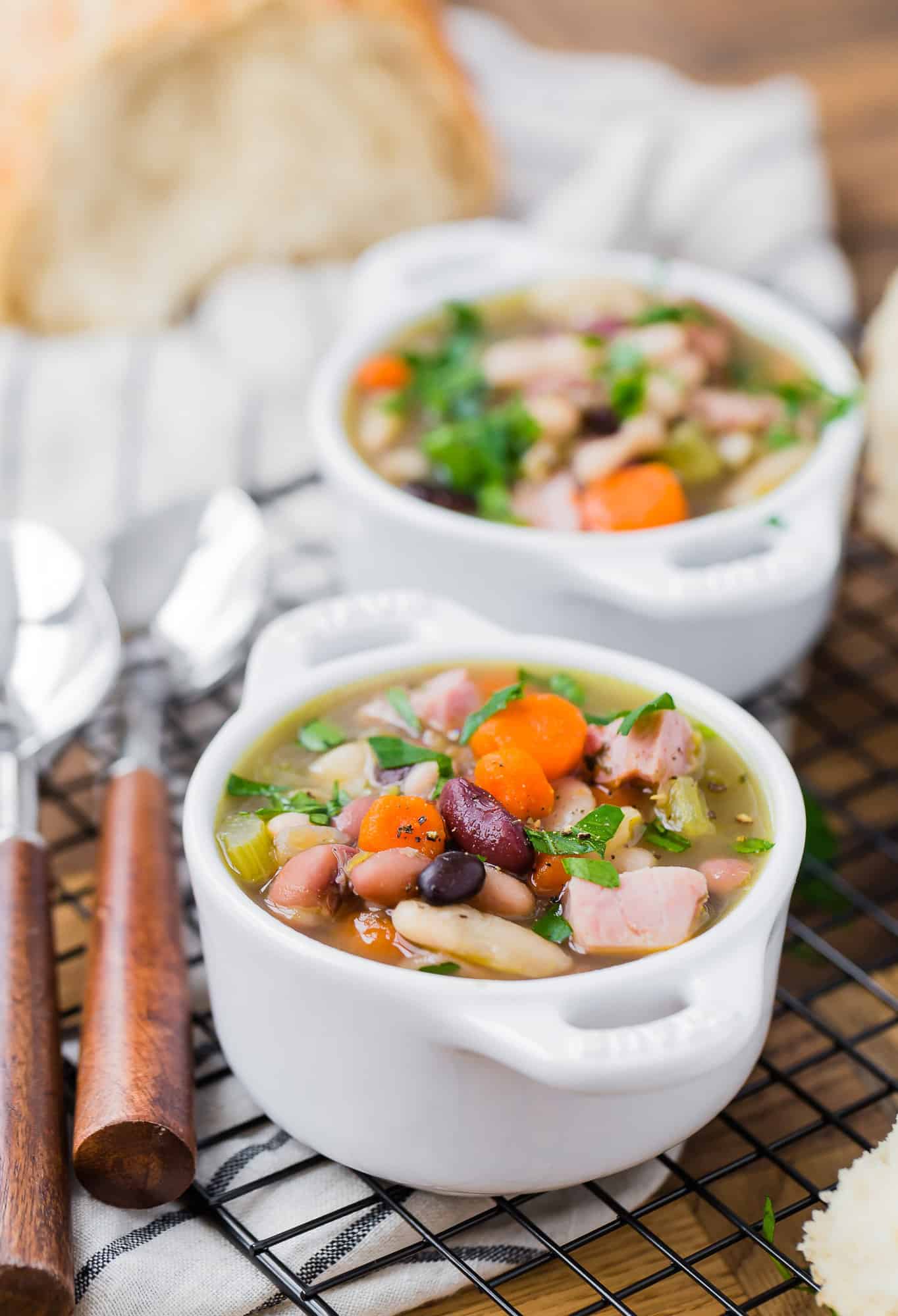 Bean soup with carrots, ham, celery, herbs.