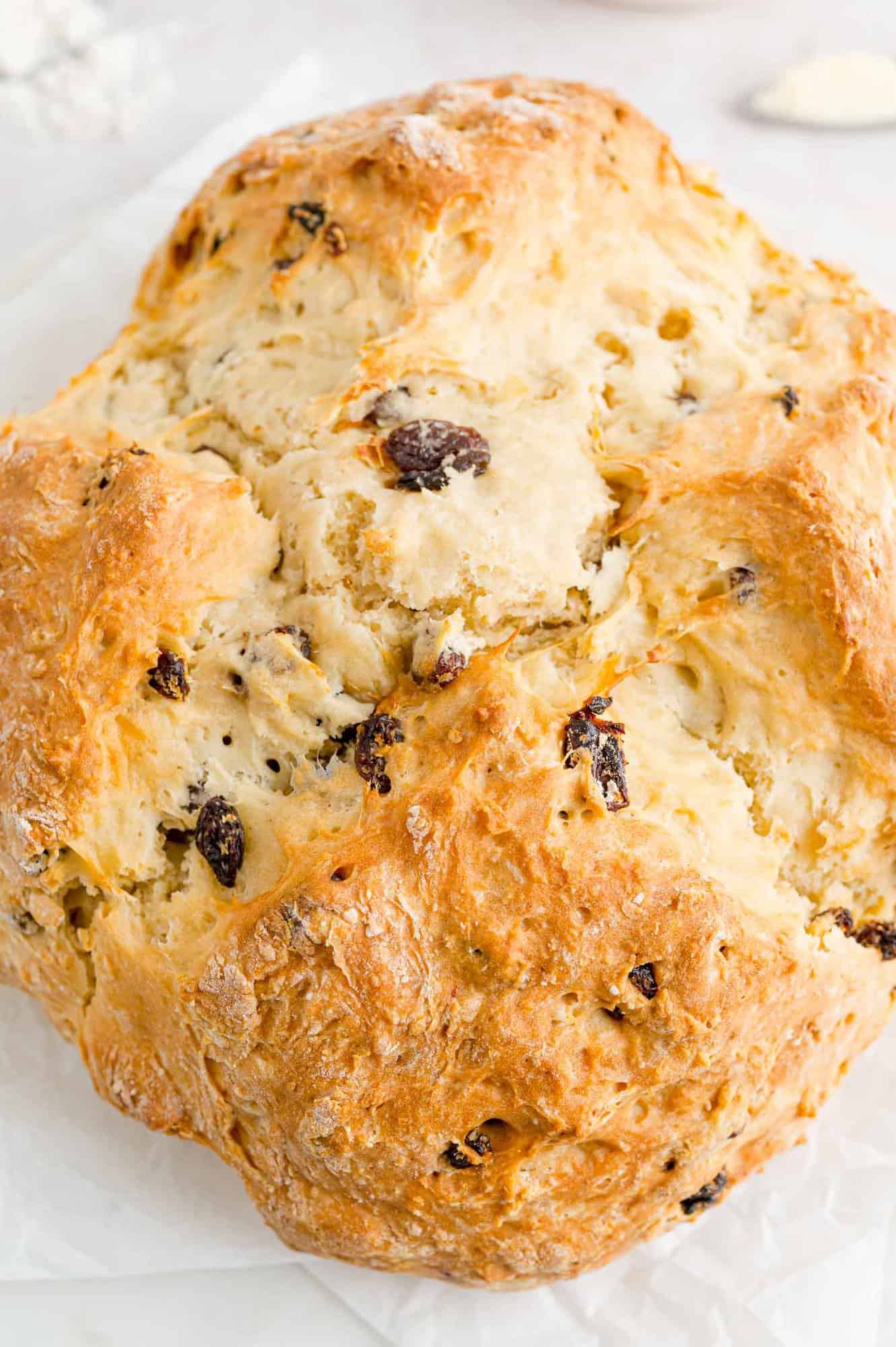 Overhead view of unsliced Irish soda bread.