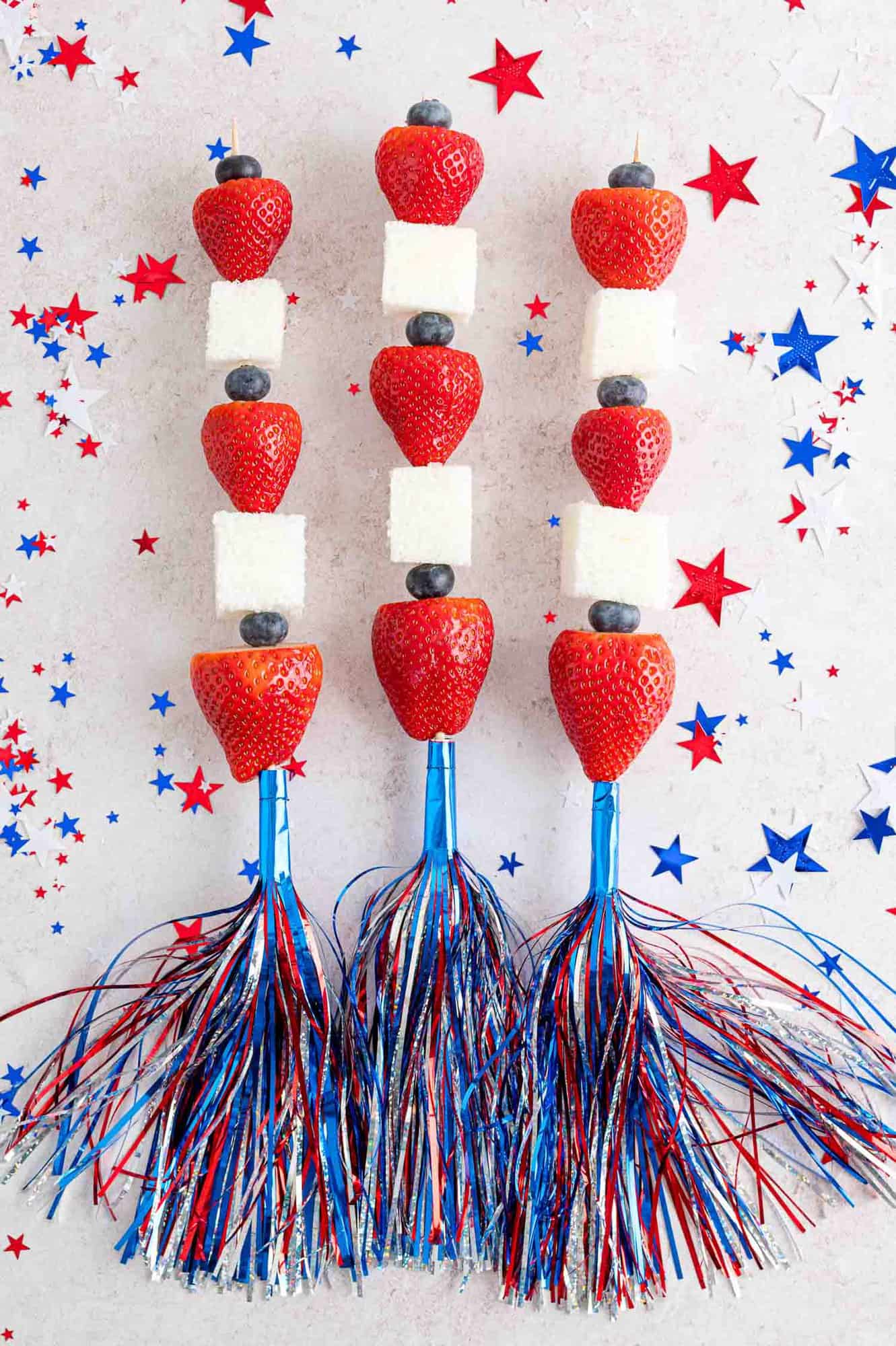 Fruit kababs with festive red, white, and blue skewers.