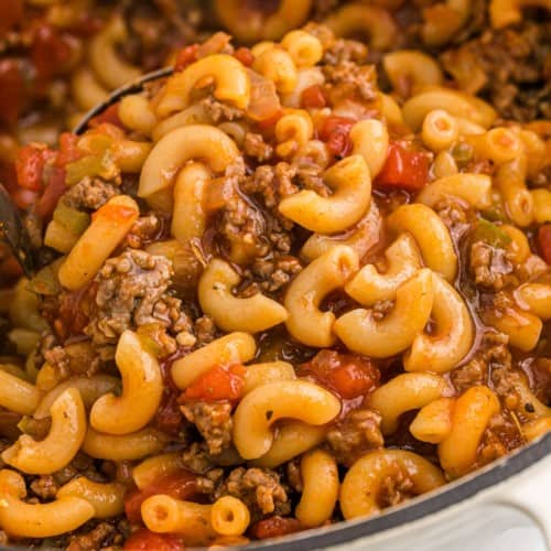 Close up view of American goulash on a ladle.