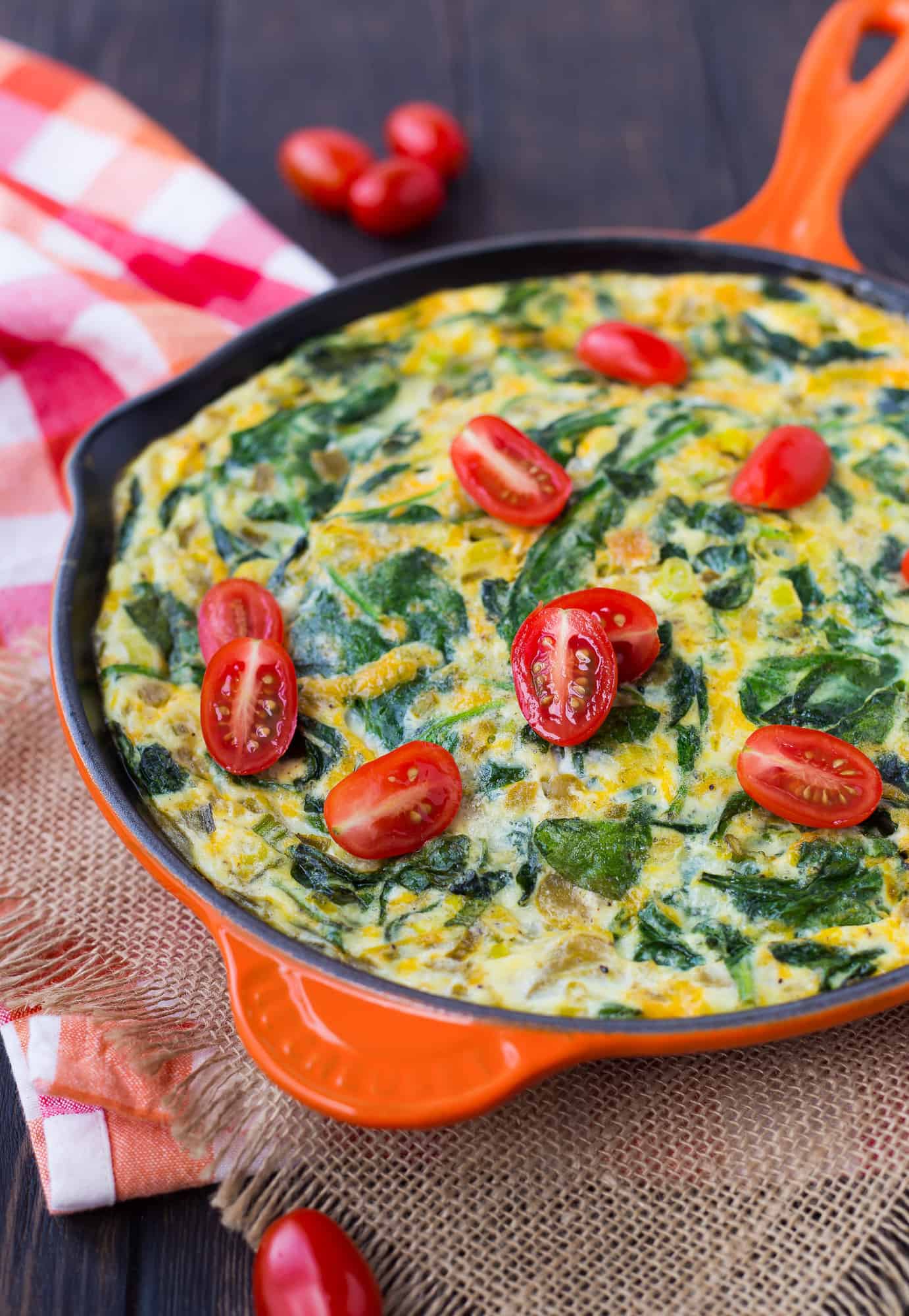 Green chile and spinach frittata in orange pan.
