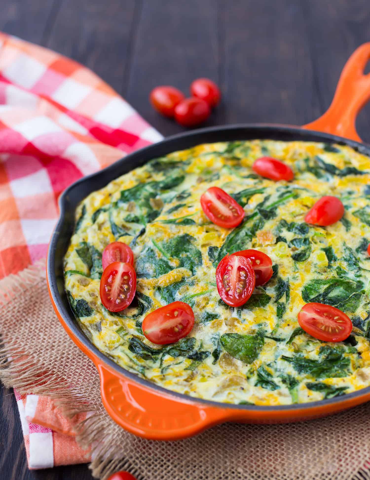 Egg white frittata topped with tomatoes.