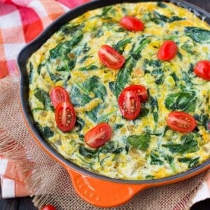 Egg white frittata topped with tomatoes.
