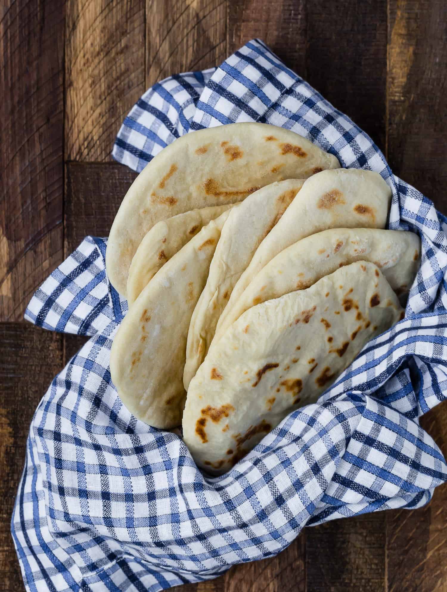 Homemade flatbread placed in a basket.