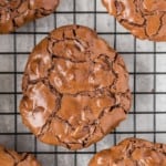 Flourless chocolate cookie on a cooling rack.