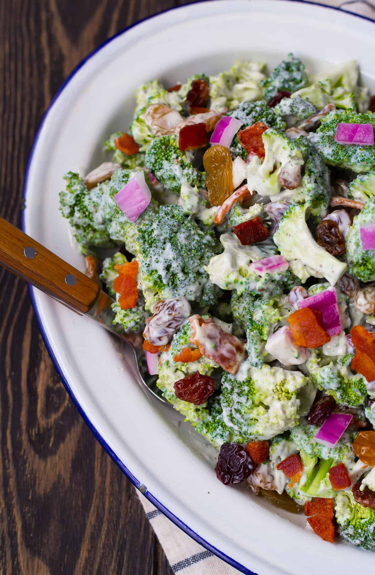 Broccoli salad with bacon, raisin, onion.