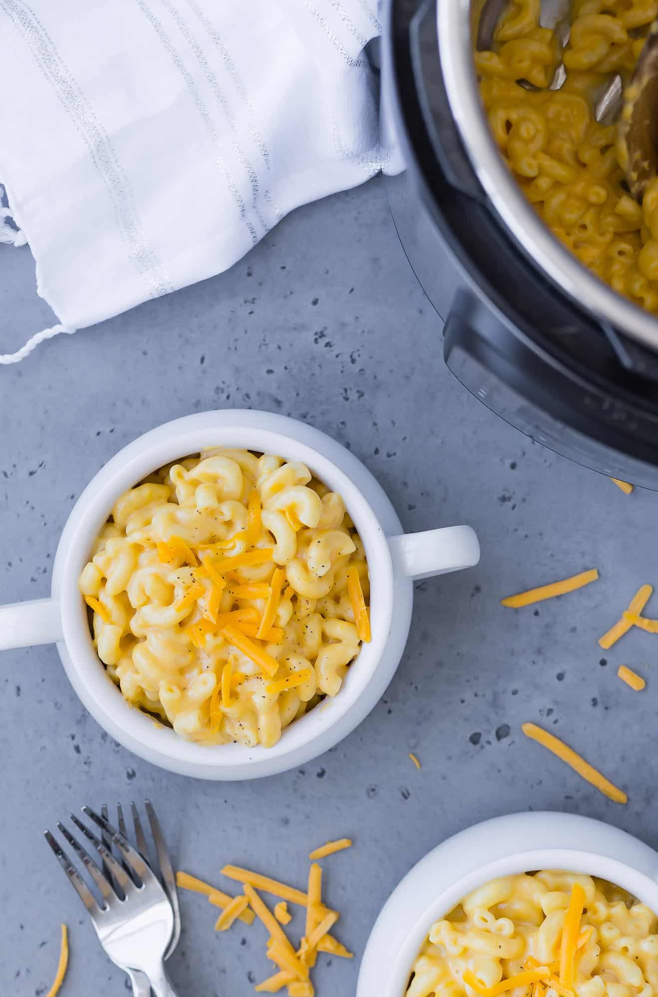 Overhead view of macaroni and cheese in white bowl.