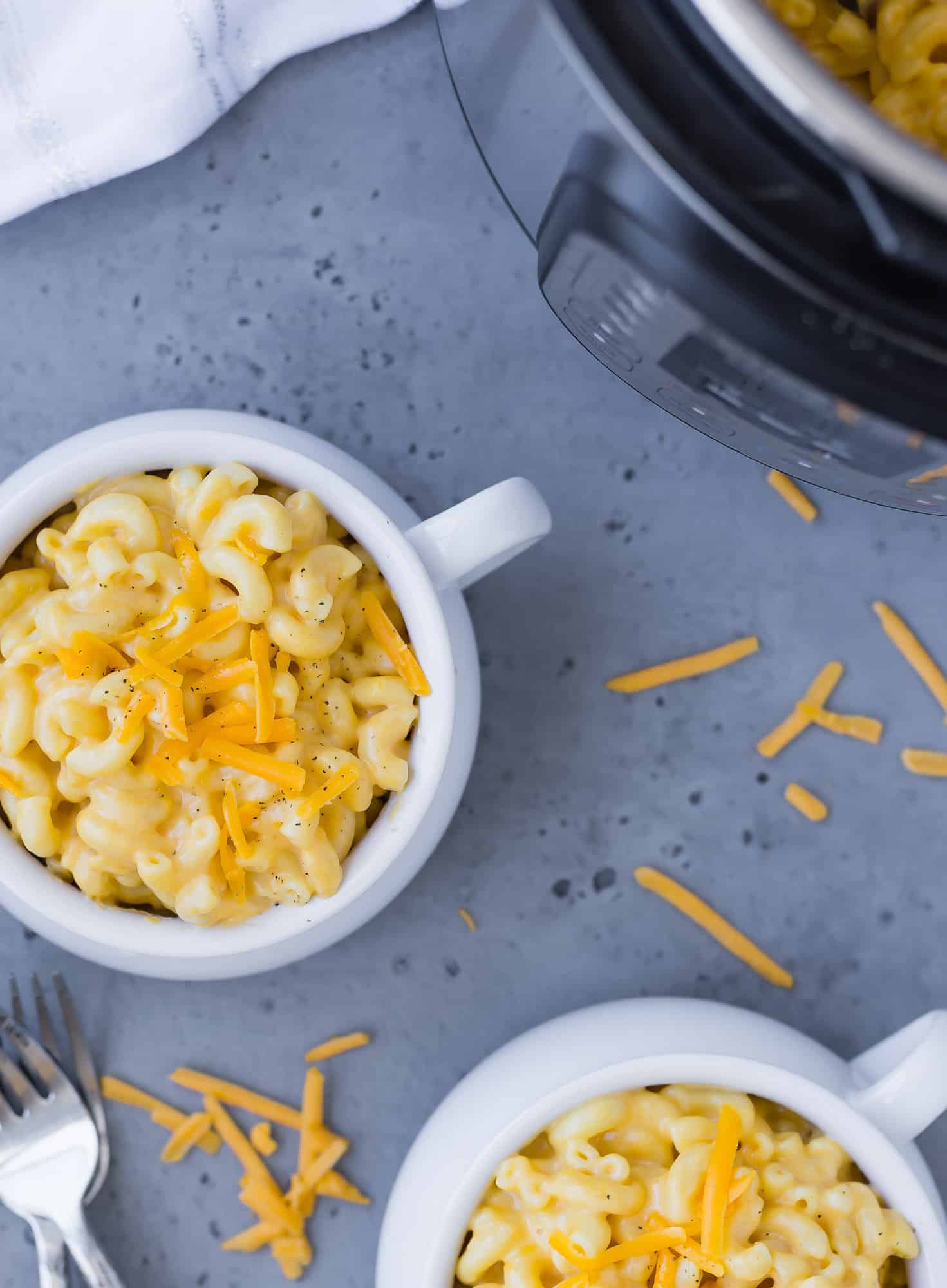 Macaroni and cheese and an Instant pot, overhead view.