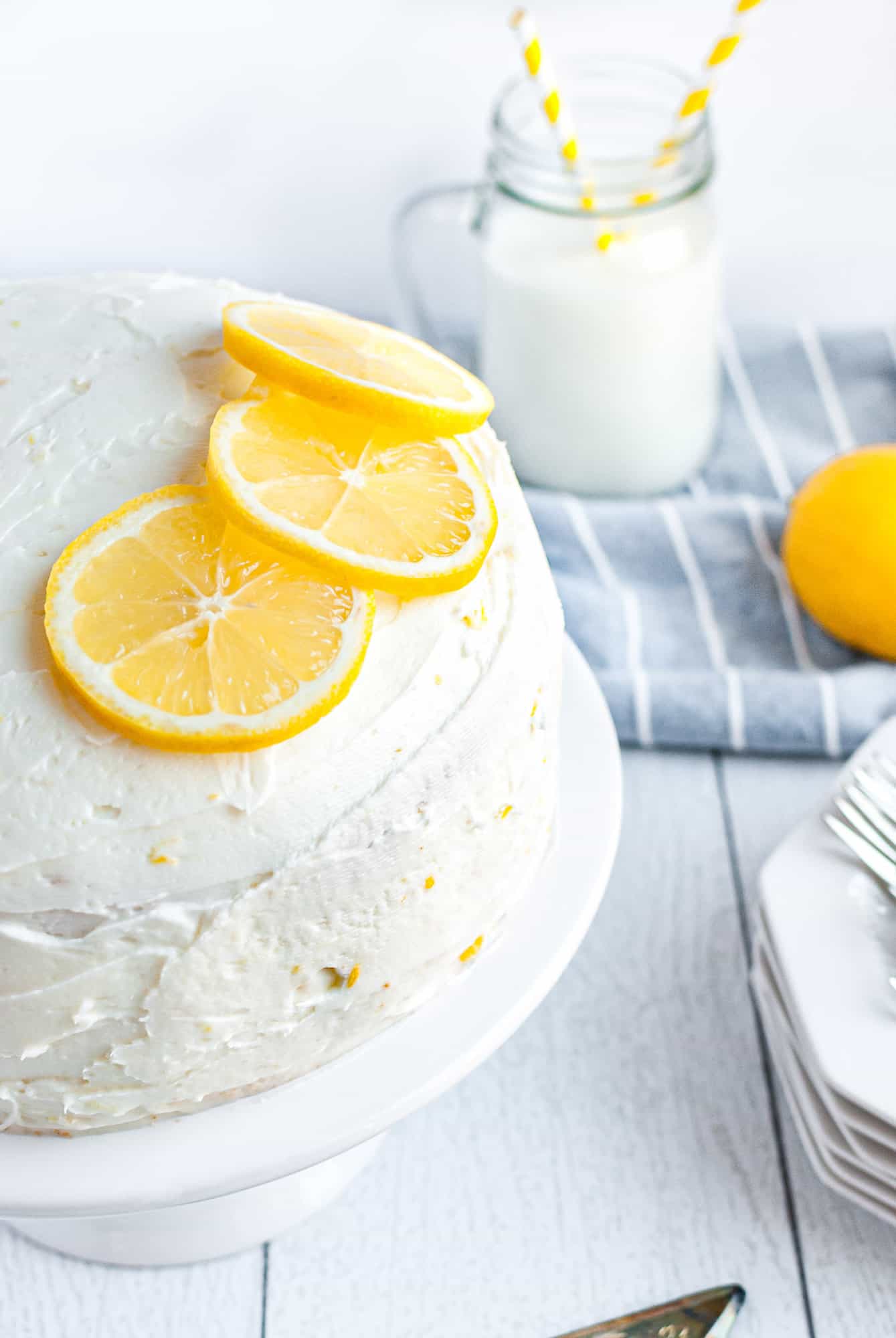 Lemon cake garnished with lemons.