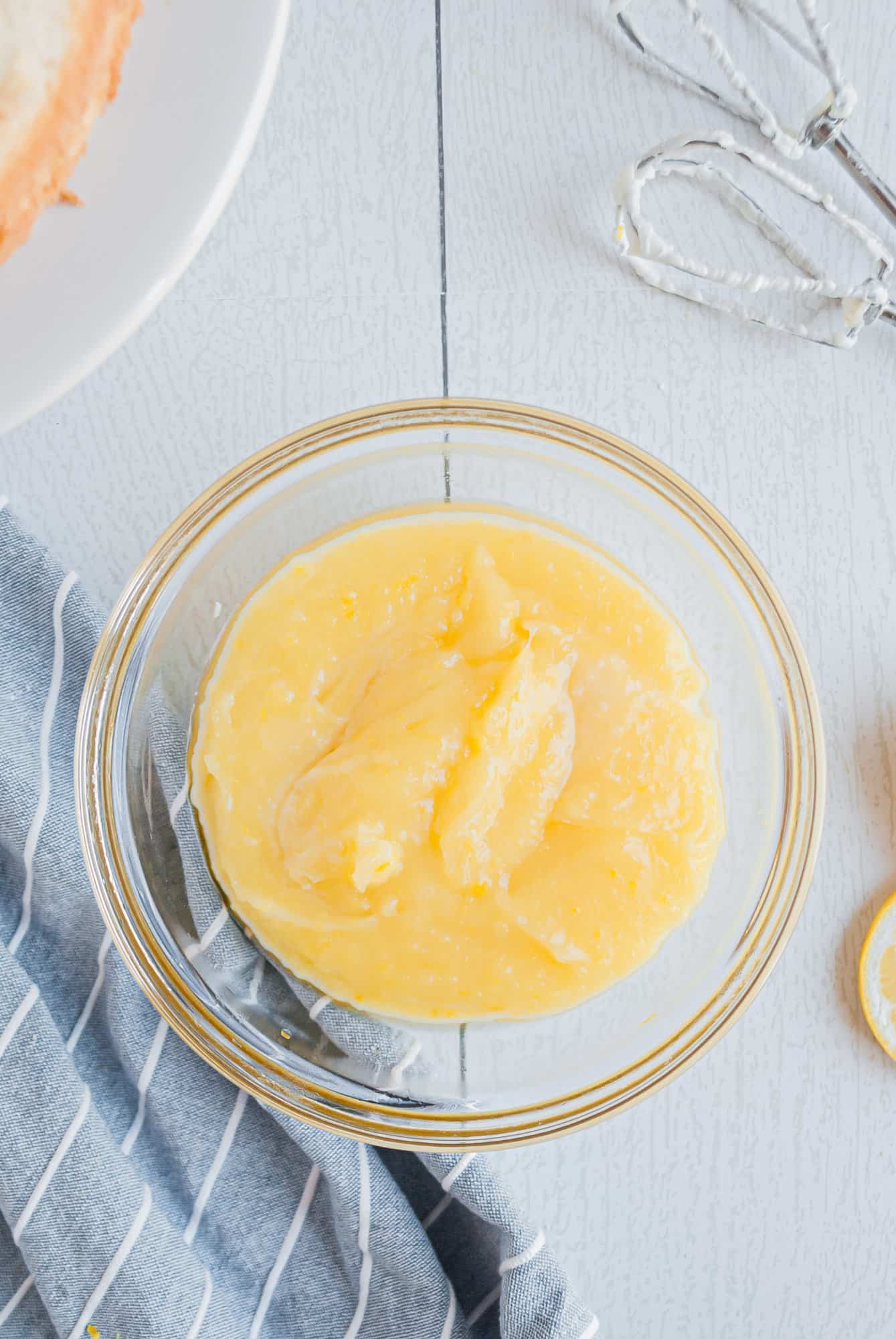 Lemon cake filling in small bowl.