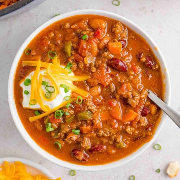Beef chili with beans in a white bowl.