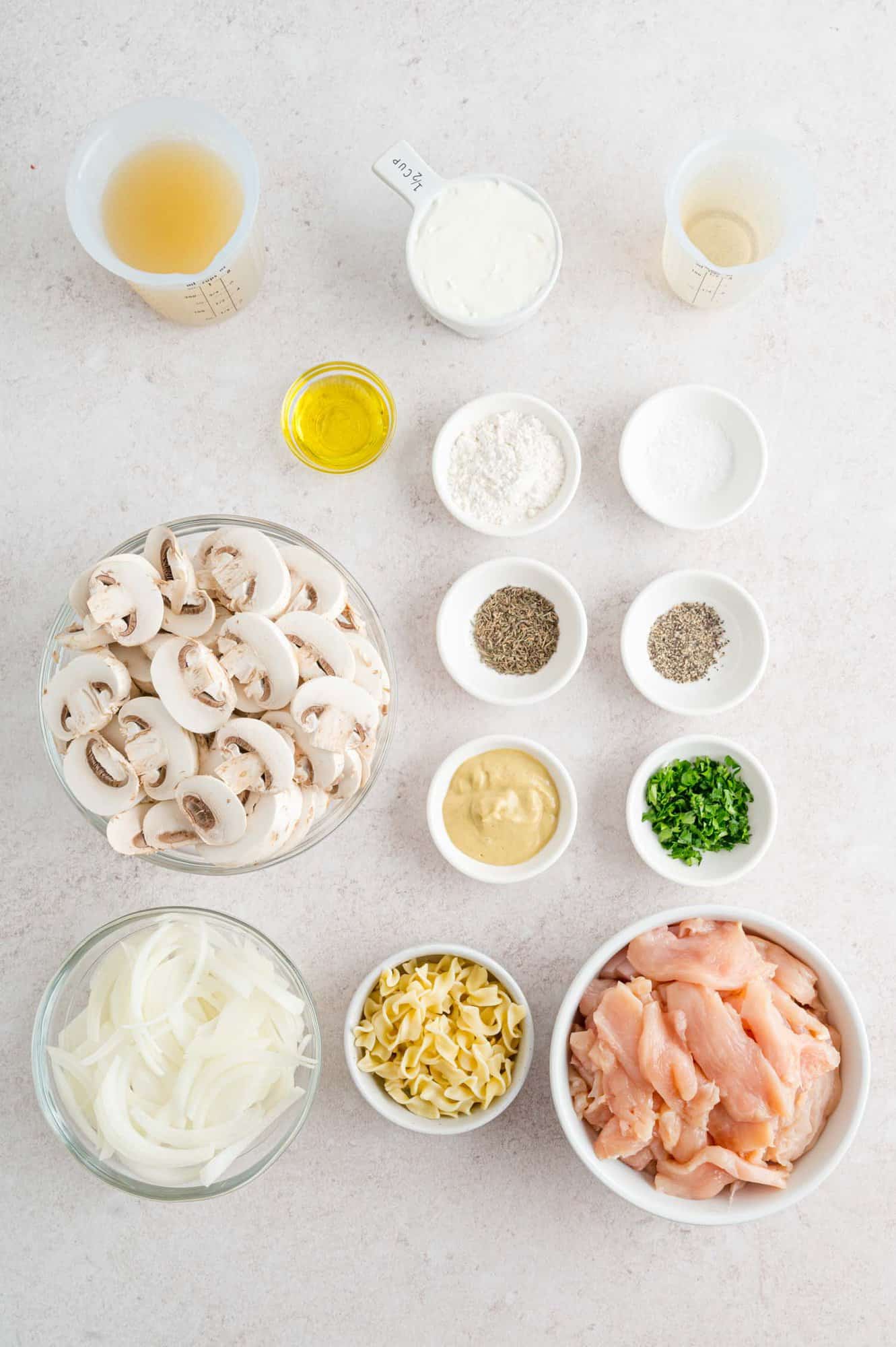 Ingredients needed for recipe including chicken and mushrooms.