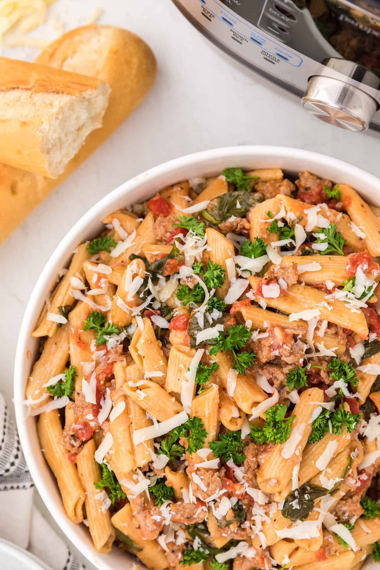 Overhead view of pasta in a white bowl.