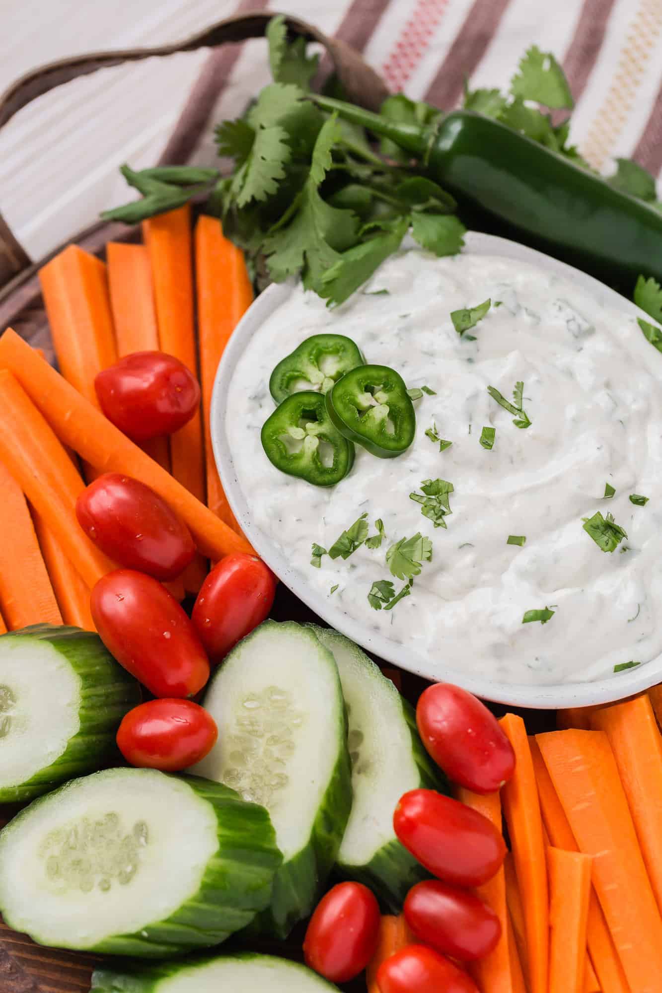 Carrots, cucumbers, tomatoes, and dip.