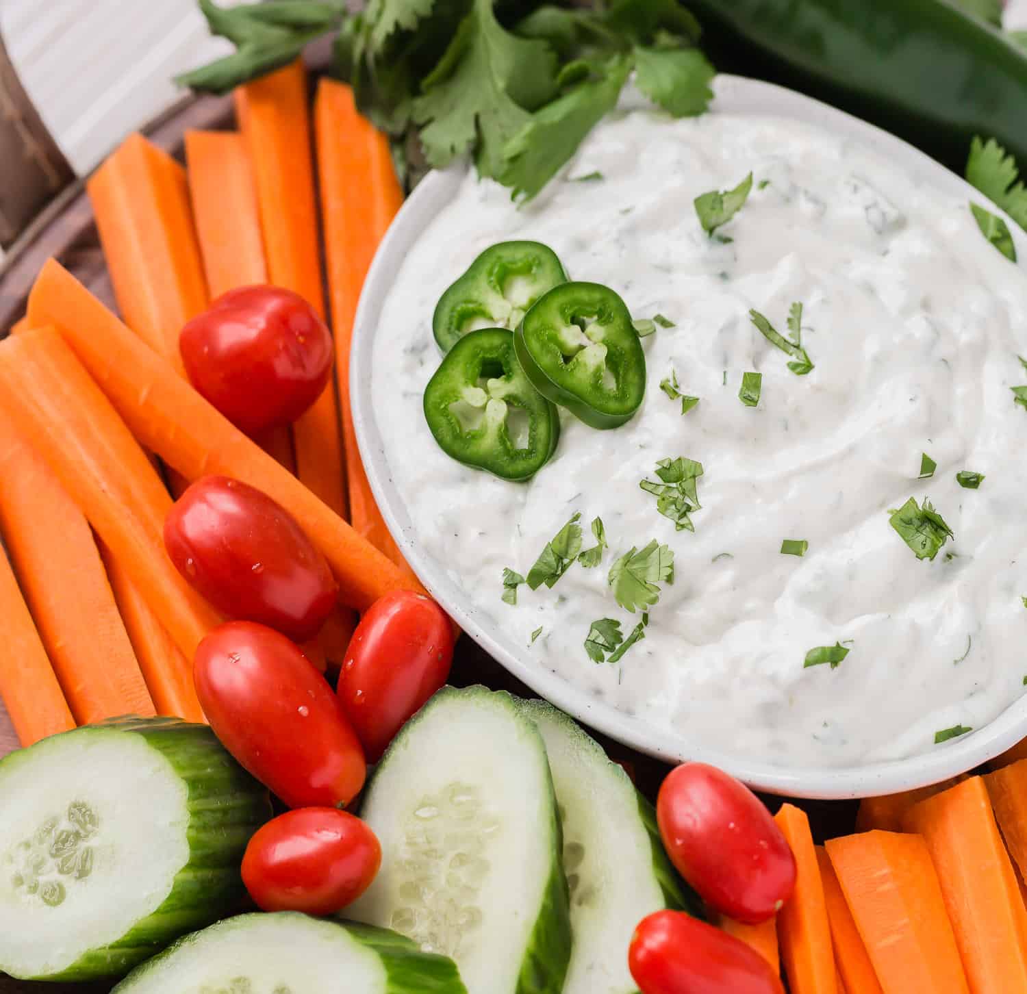 Southwestern ranch dip surrounded by vegetables.
