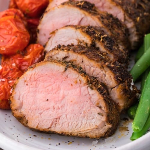 Sliced spice rubbed pork tenderloin.