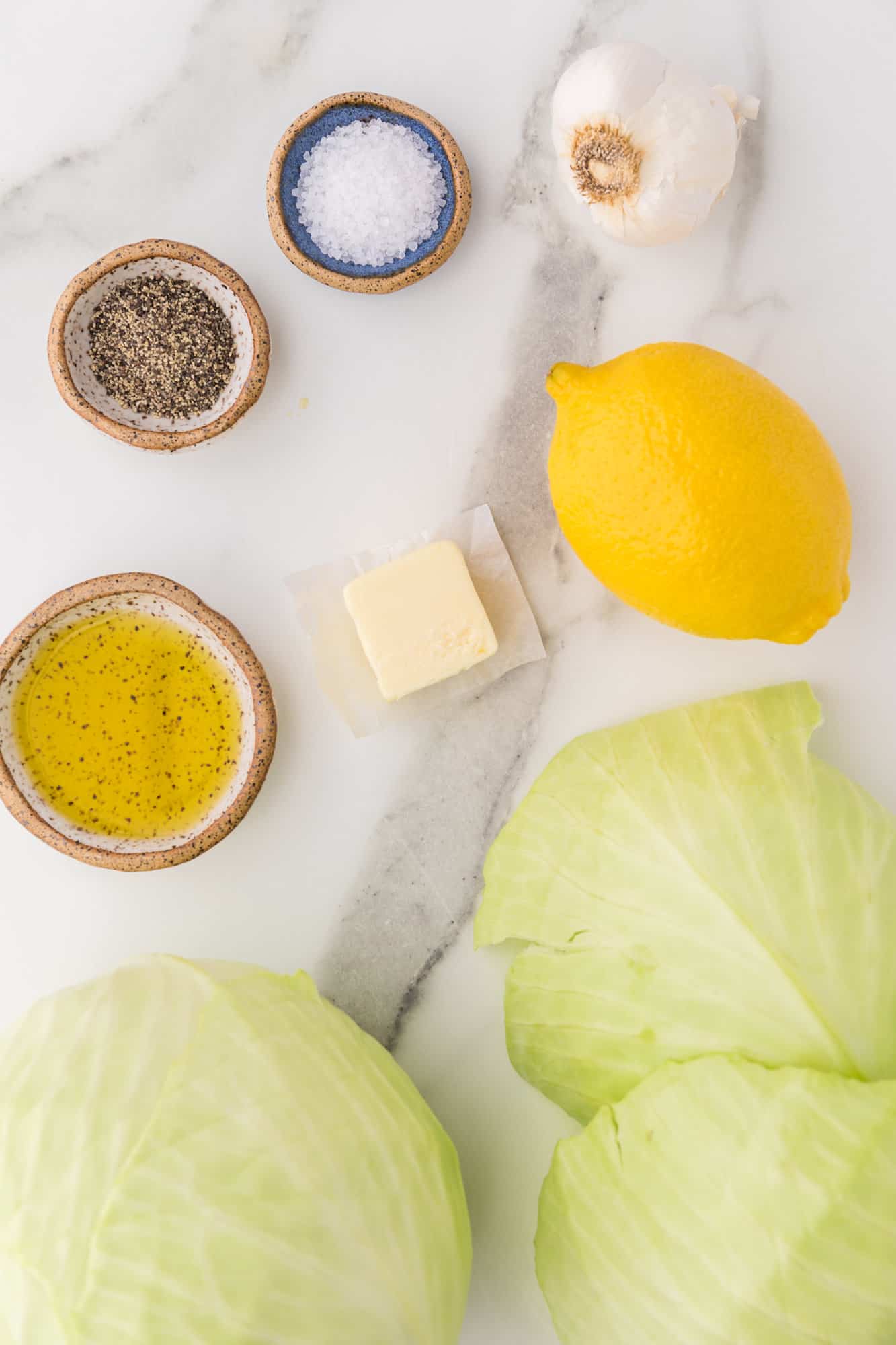 Ingredients needed for recipe, including head of cabbage.