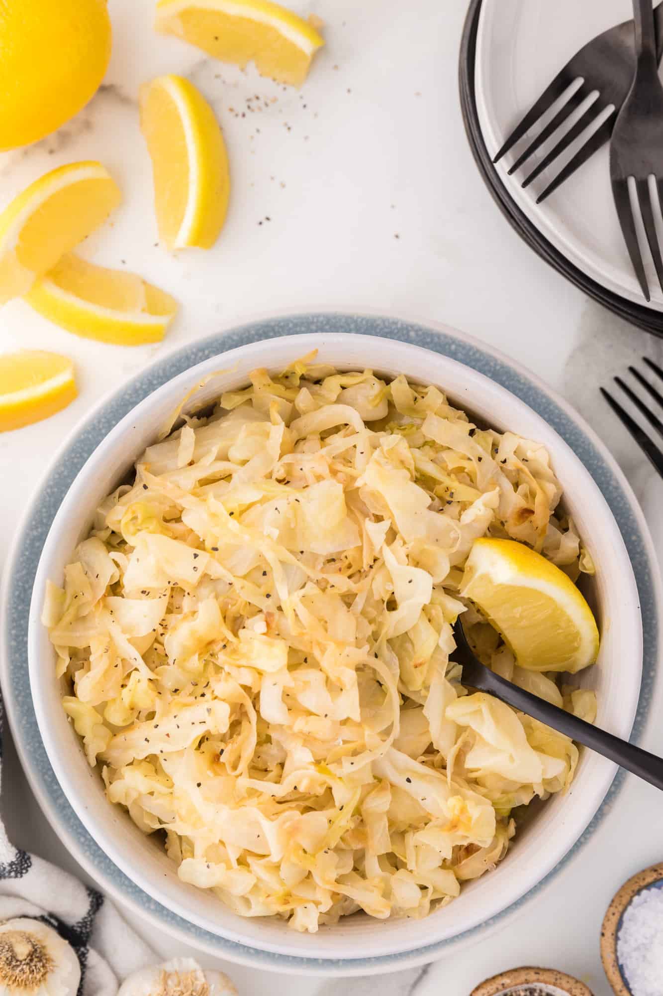 Cooked shredded cabbage in a large serving bowl.