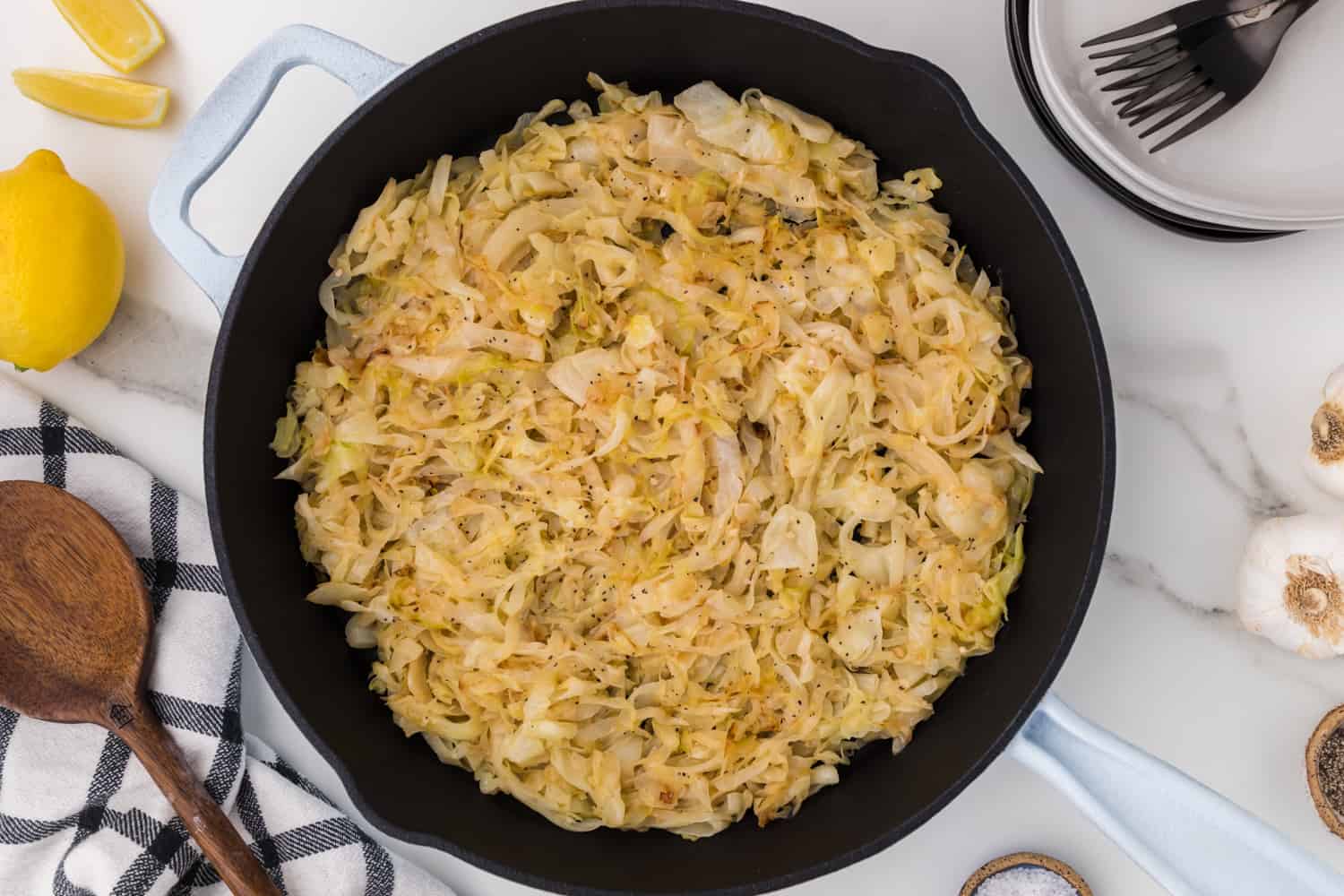 Cooked cabbage in skillet.