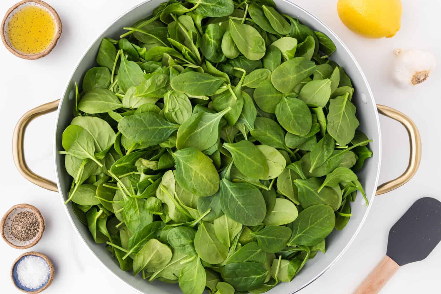 Uncooked spinach in a pan.