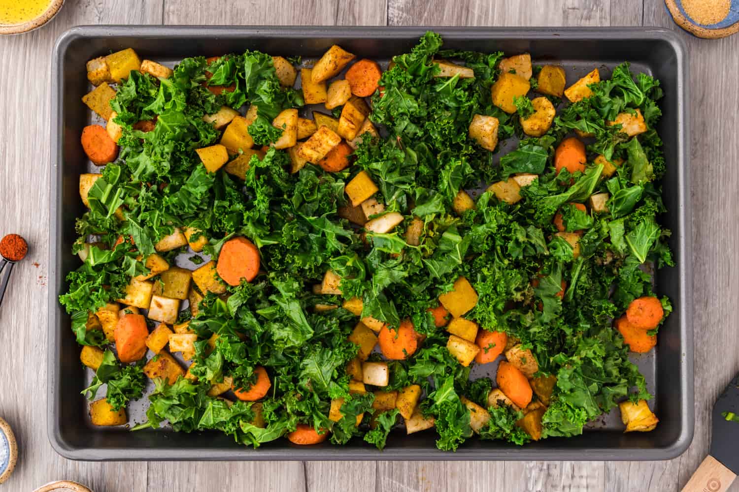 Vegetables and kale stirred together.