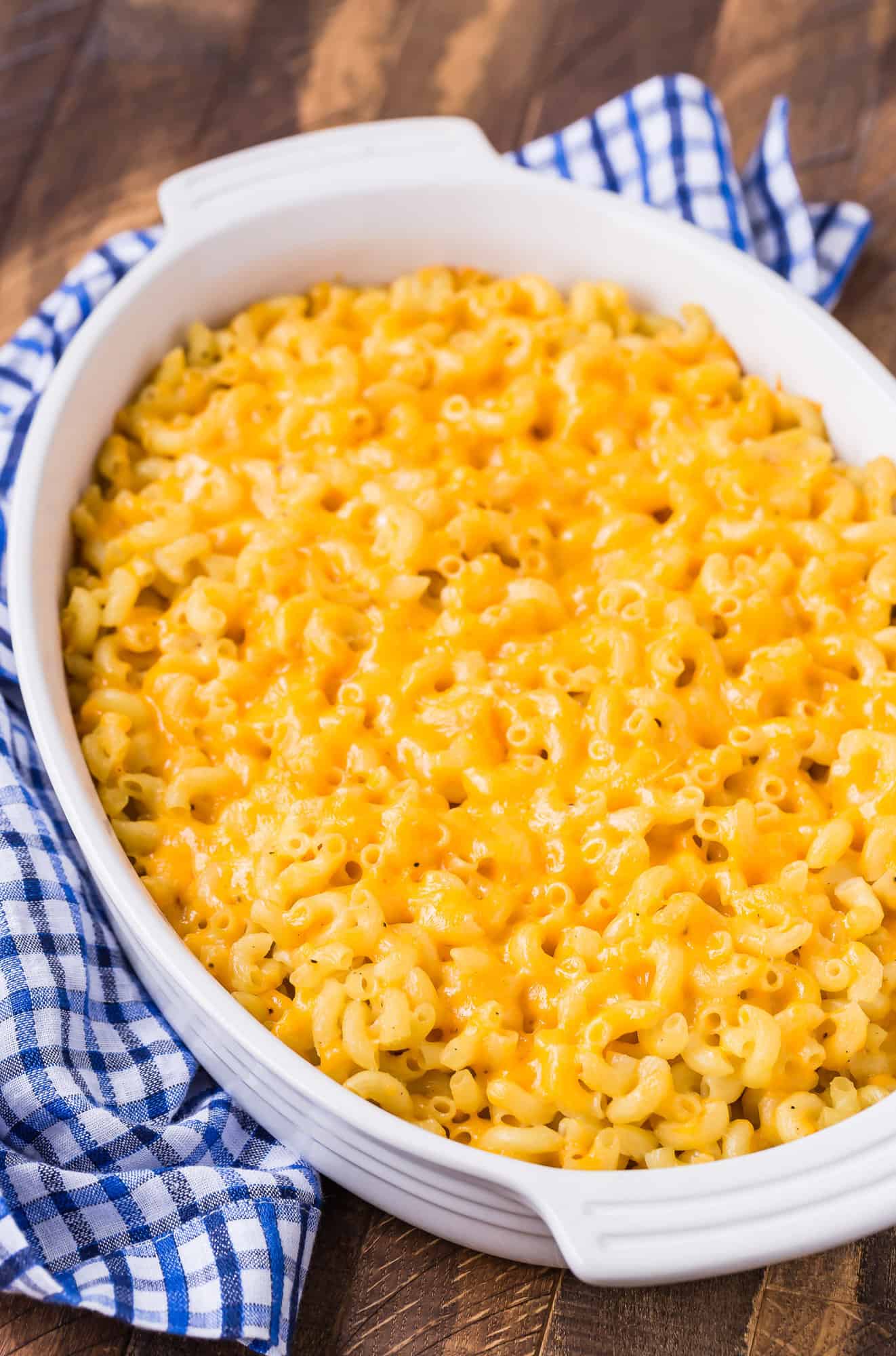 Baked macaroni and cheese in white baking dish.