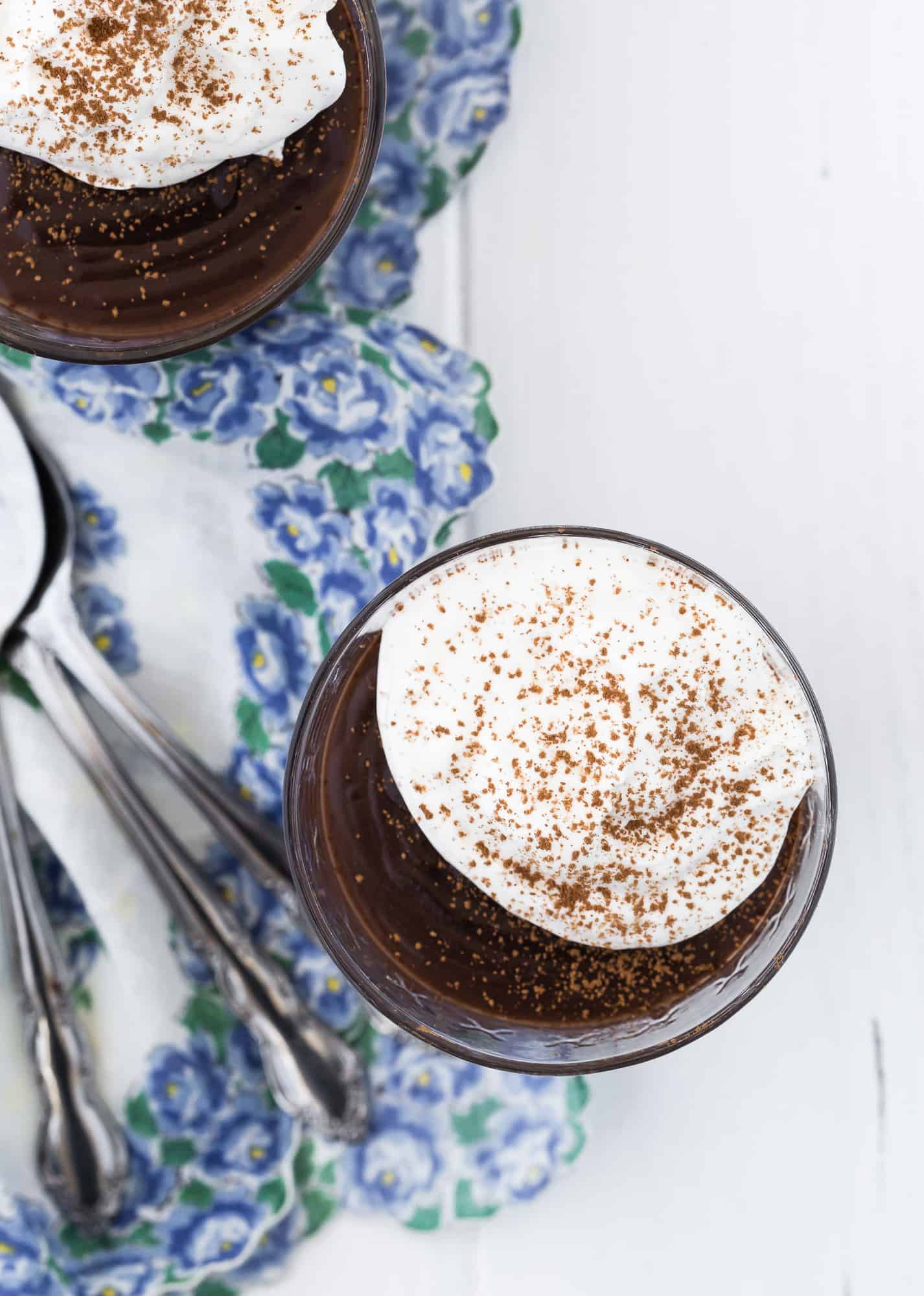 Chocolate pudding topped with whipped cream.