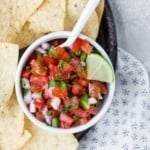 Pico de gallo in a white bowl.