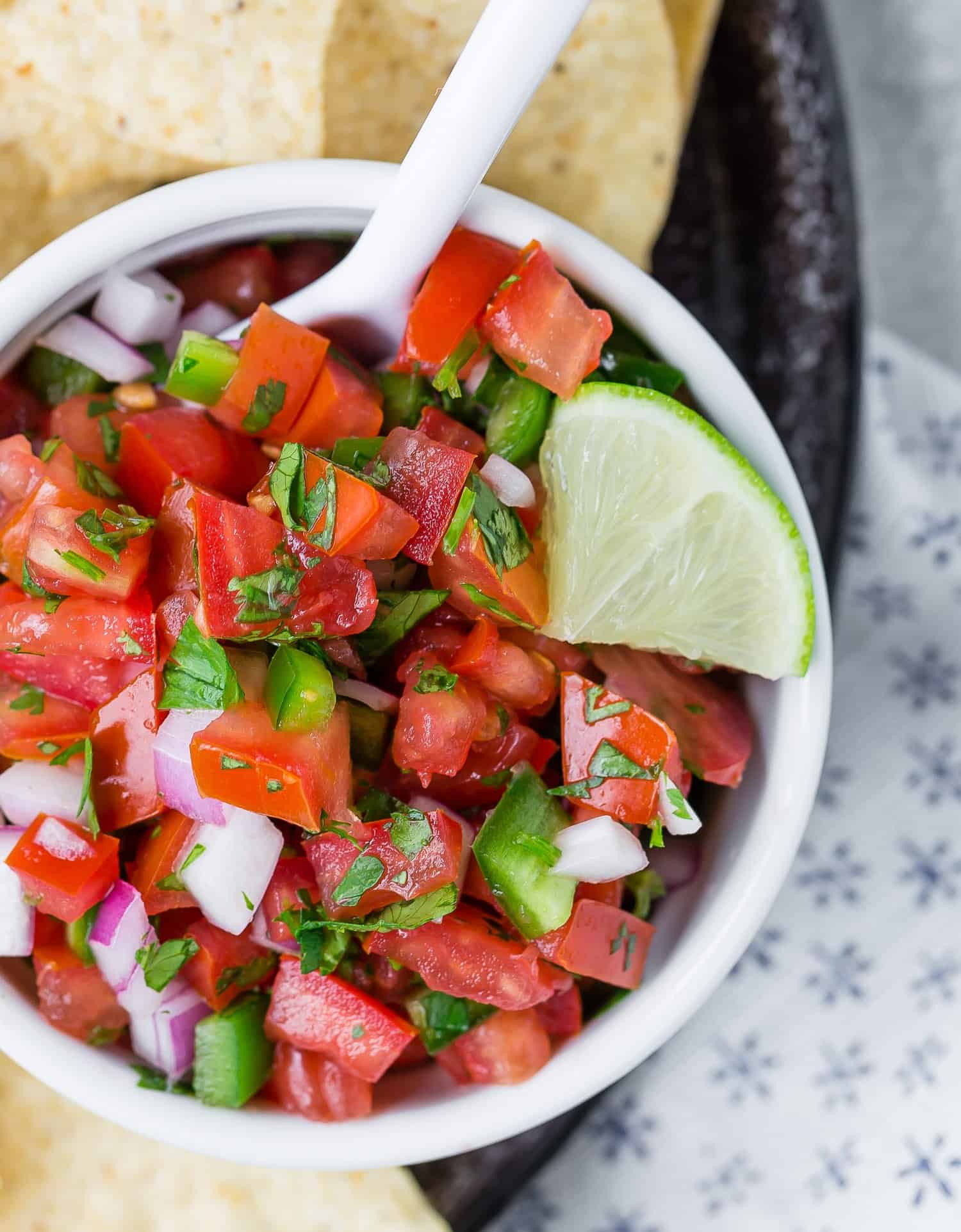 Pico de gallo in a white bowl.